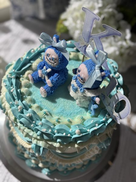 A decorated buttercream celebration cake